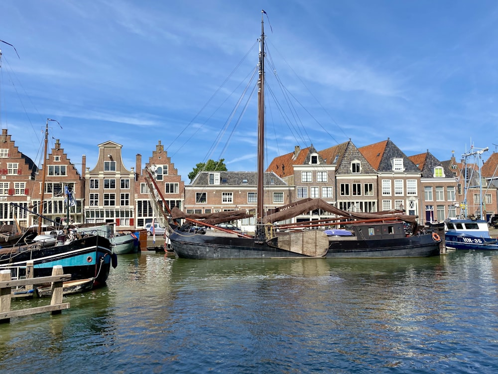 boat on dock near houses during daytime