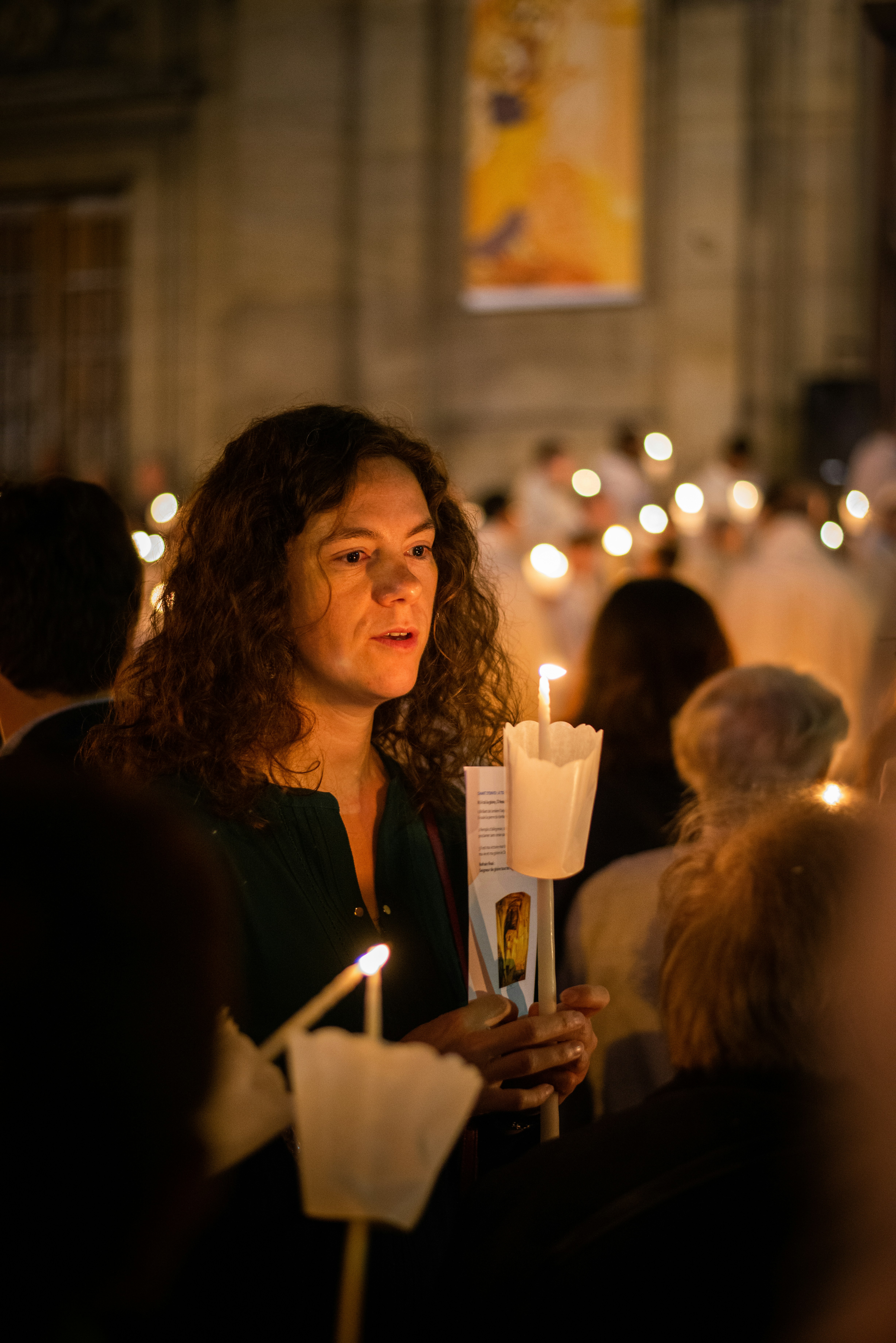 woman in black long sleeve shirt holding white ceramic mug