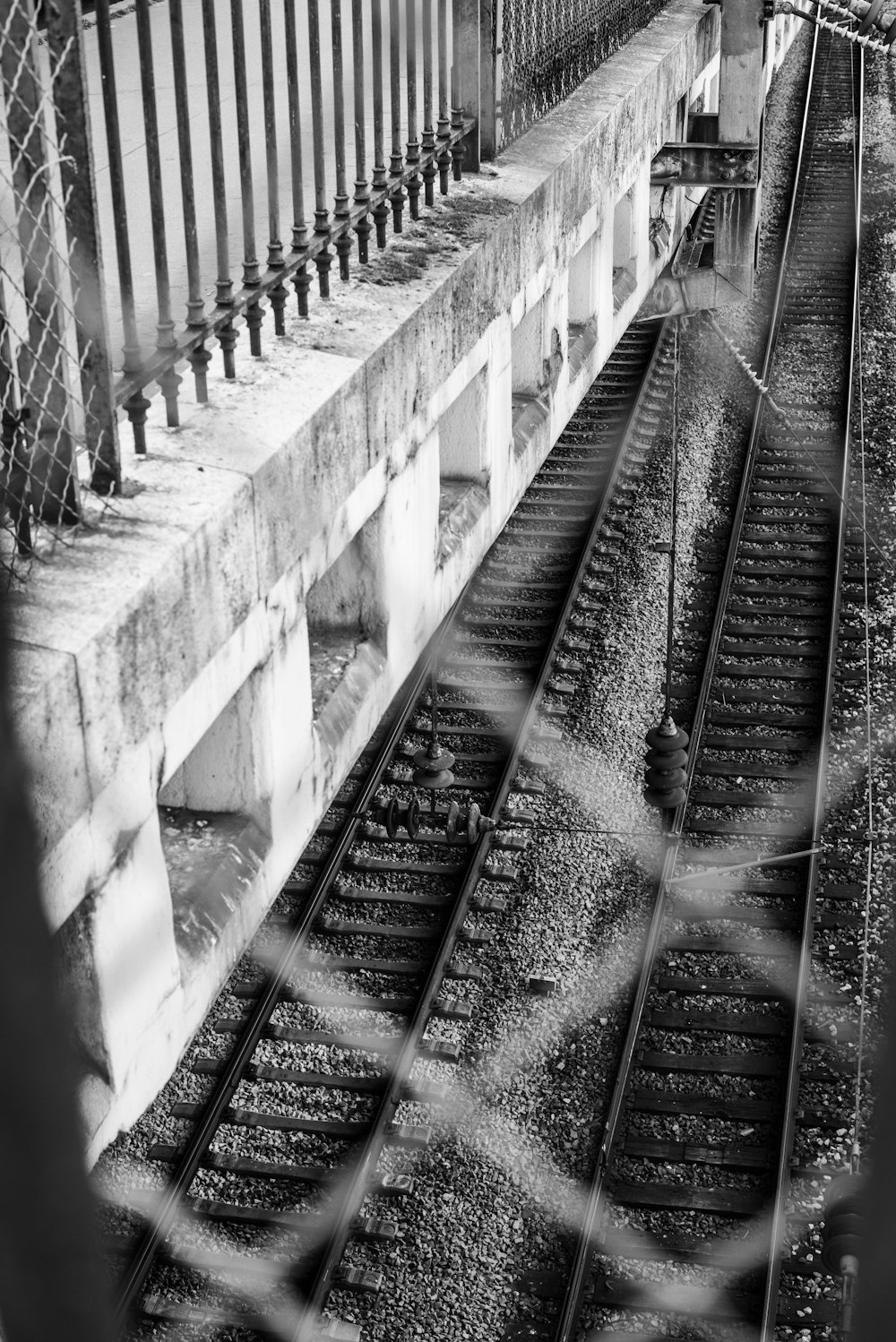 a black and white photo of a train track