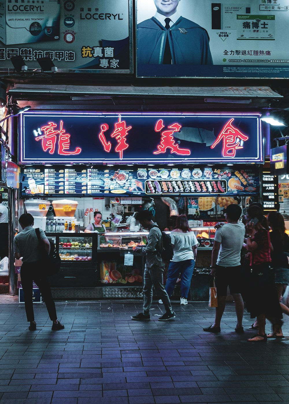 people walking on street during nighttime