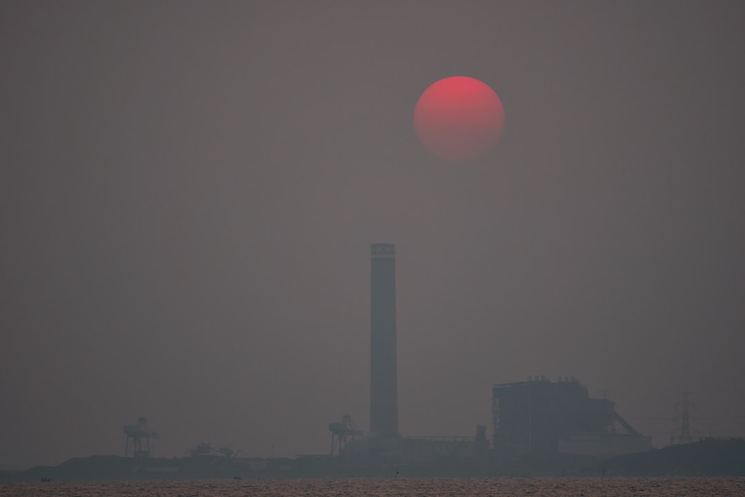 city skyline under pink sky during daytime