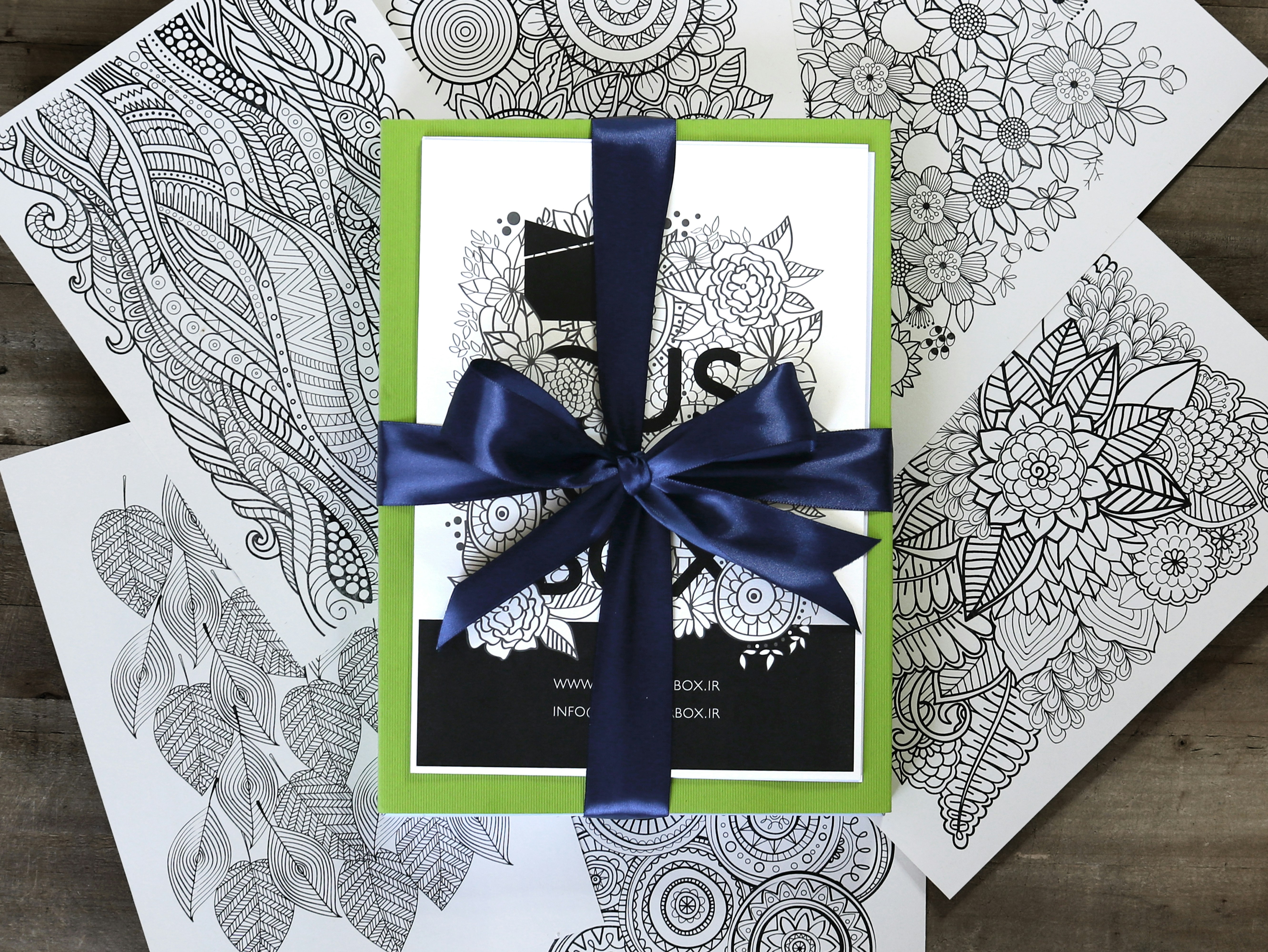 blue and white floral box with blue ribbon