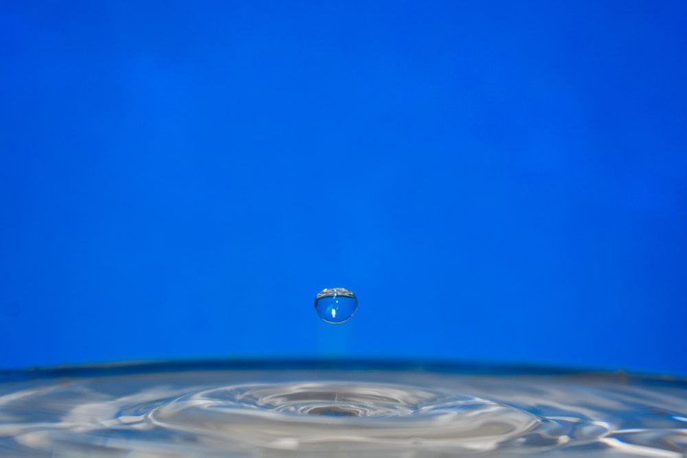 water drop on blue surface