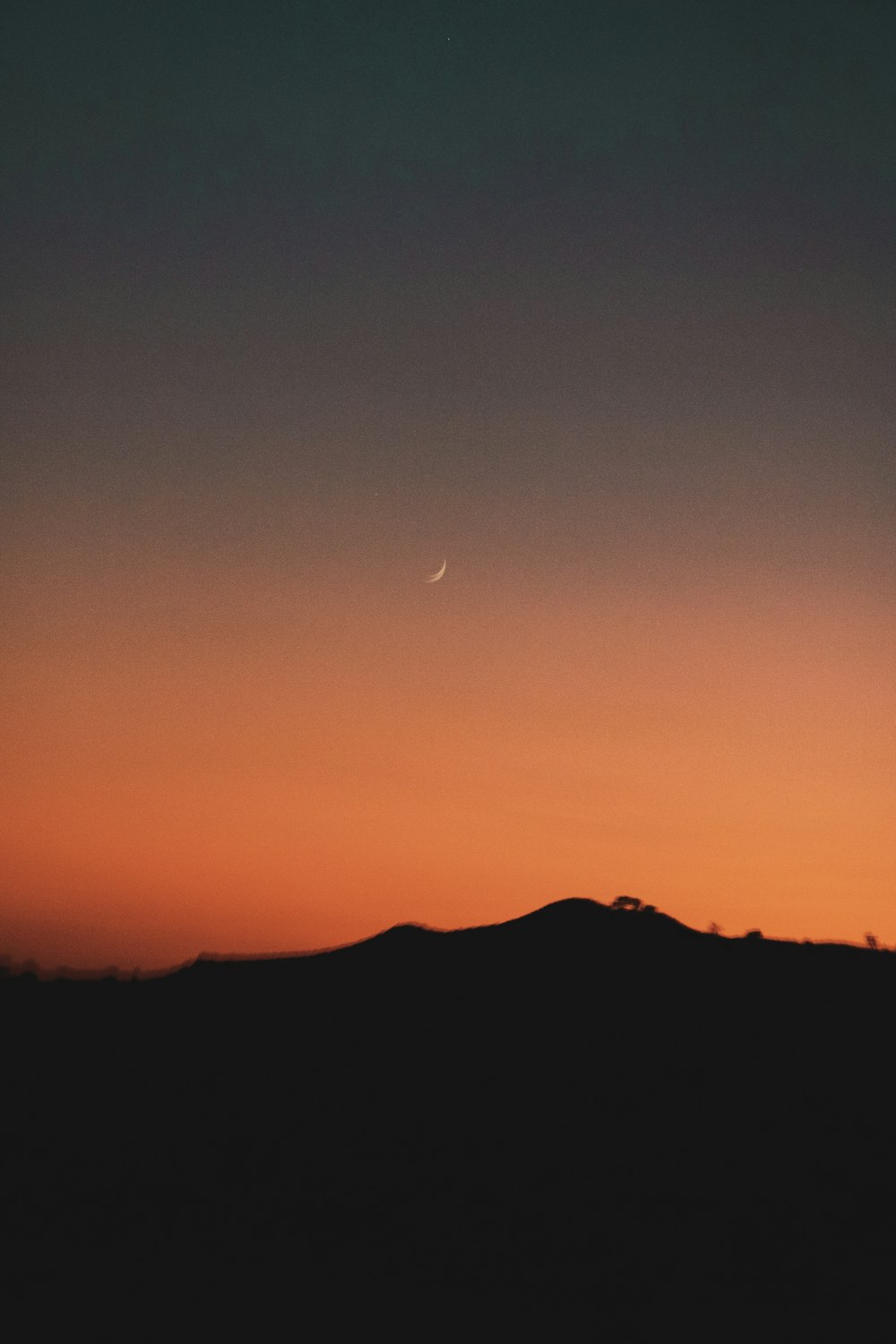 silhouette of mountain during sunset