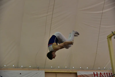 Close-up of a focused teen gymnast preparing for a vault during the leadership event.