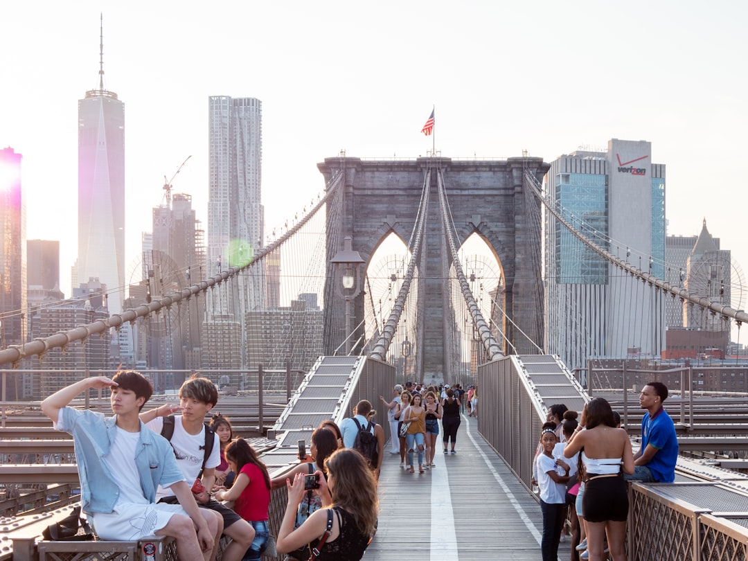 people walking on bridge during daytime