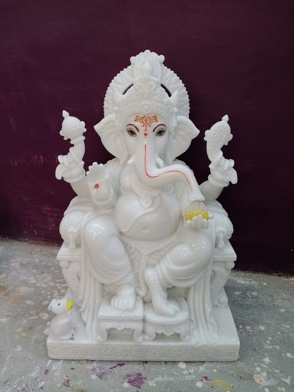 white ceramic figurine on white table