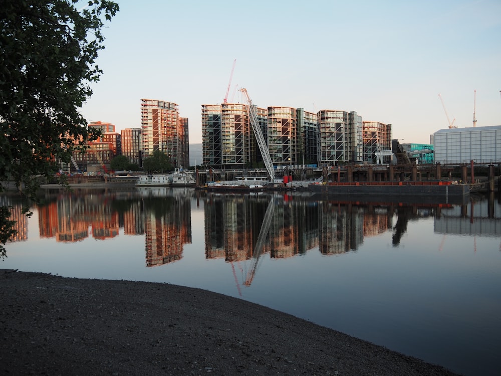 city skyline near body of water during daytime