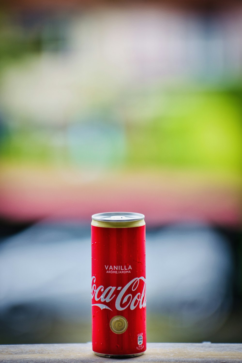 coca cola can on brown wooden table