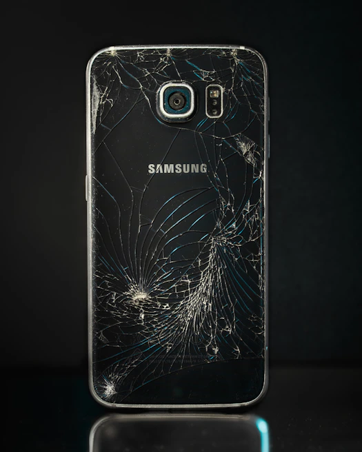 Before and after side-by-side of a cracked phone screen replaced with a flawless display