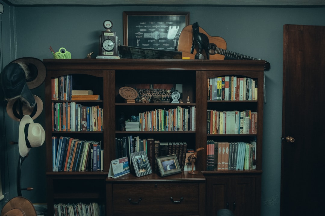 books on brown wooden shelf