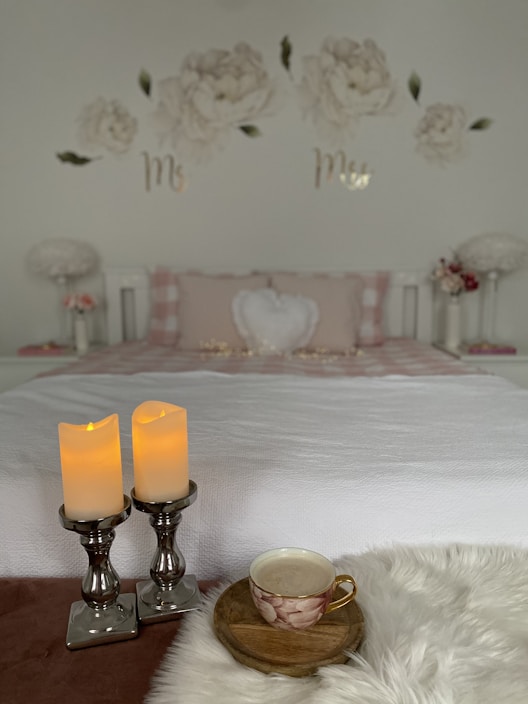 A cozy bedroom setup featuring soft bedding and elegant decor.