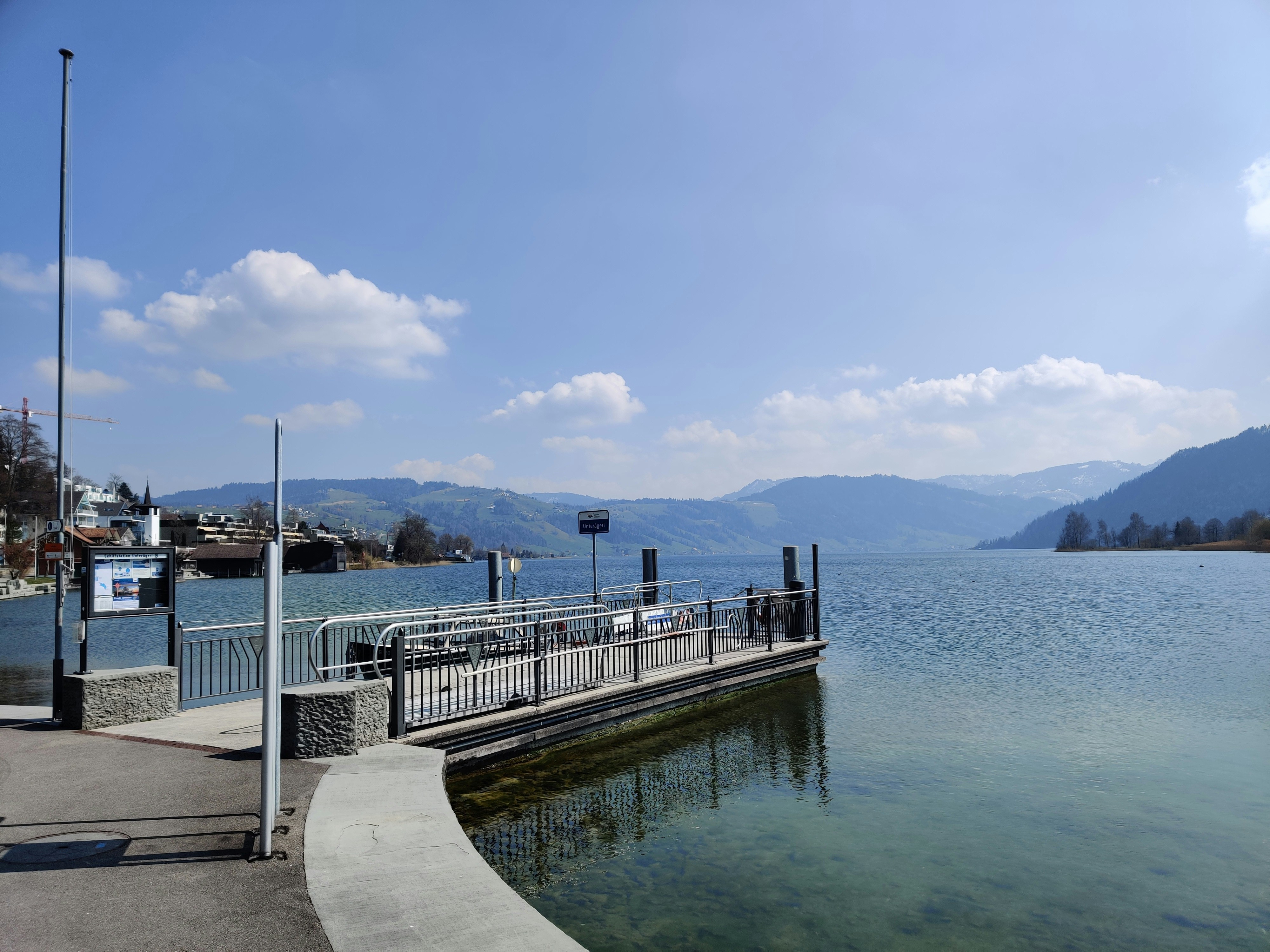 white and brown wooden dock on body of water during daytime