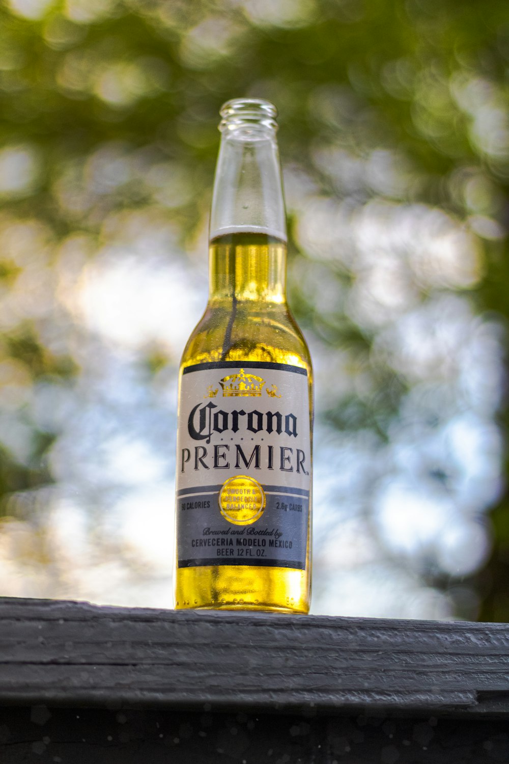 corona extra beer bottle on gray wooden table