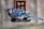 blue and white bird on brown wooden cage
