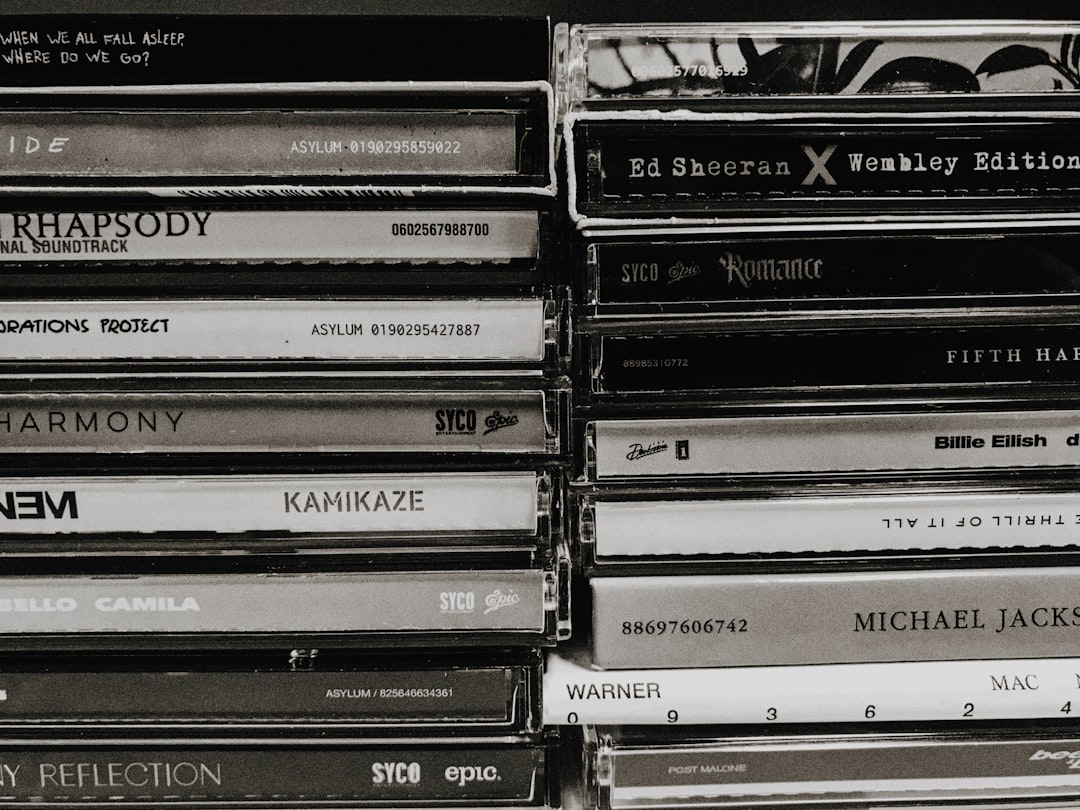 a stack of cds sitting on top of each other