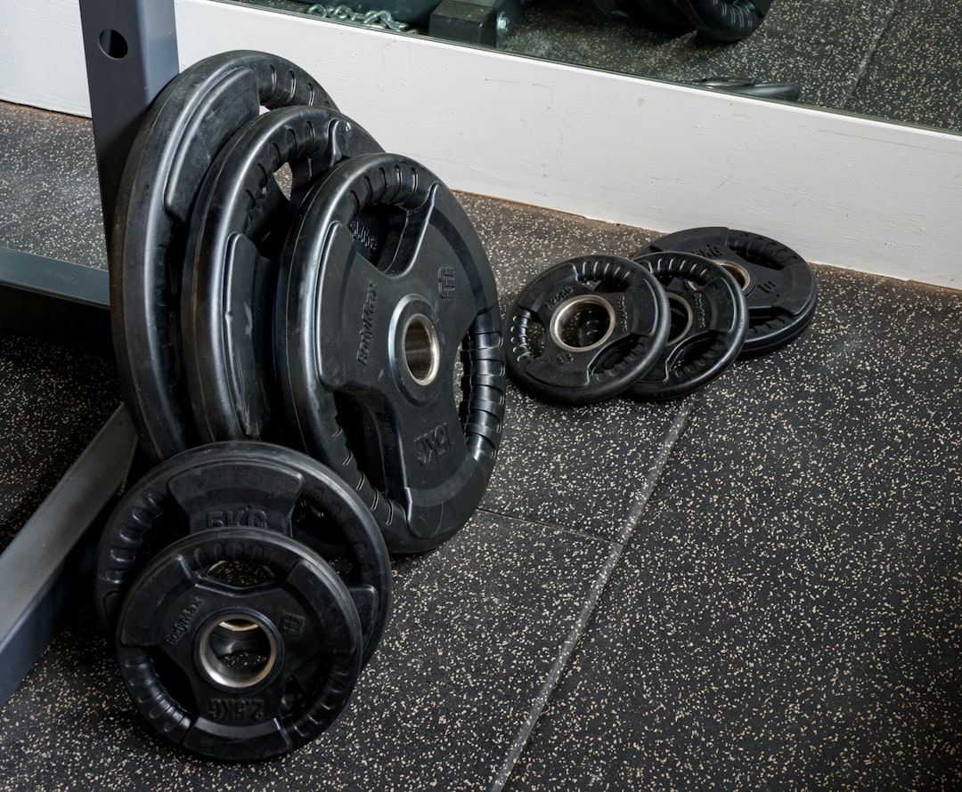 black and silver dumbbells on gray floor
