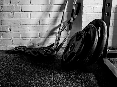 High-quality photo of a set of colorful weight plates stacked neatly in a gym setting