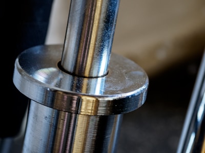 silver and gold steel tube