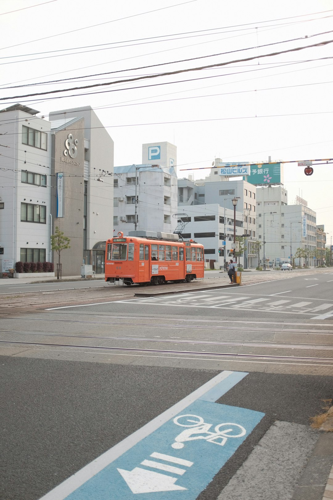 red and yellow tram on road during daytime