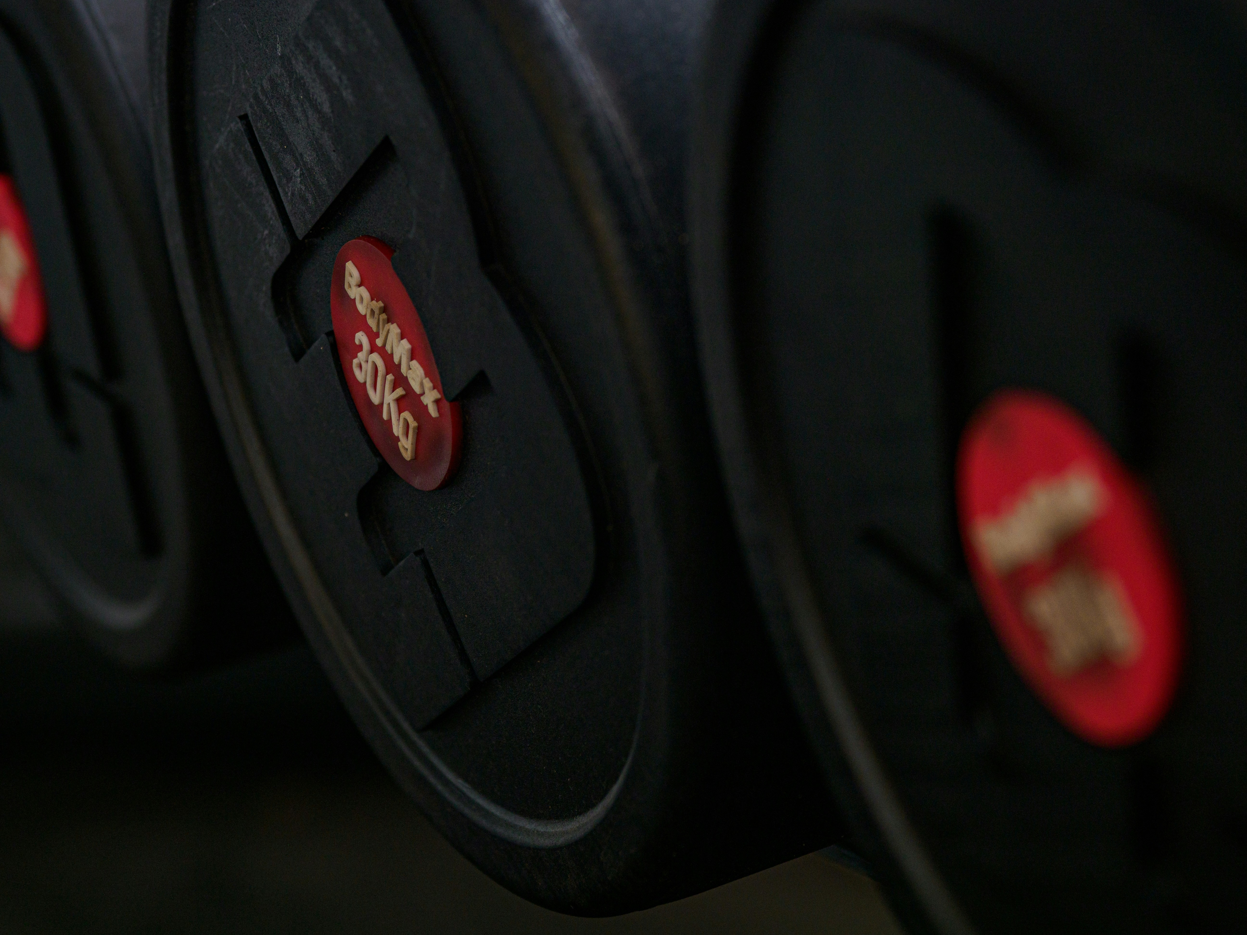 Close-up of dark red and black weight plates
