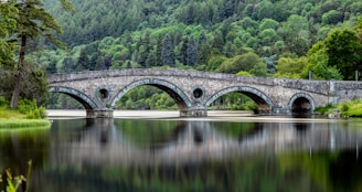 Corporate training video production: gray concrete bridge spanning over a river