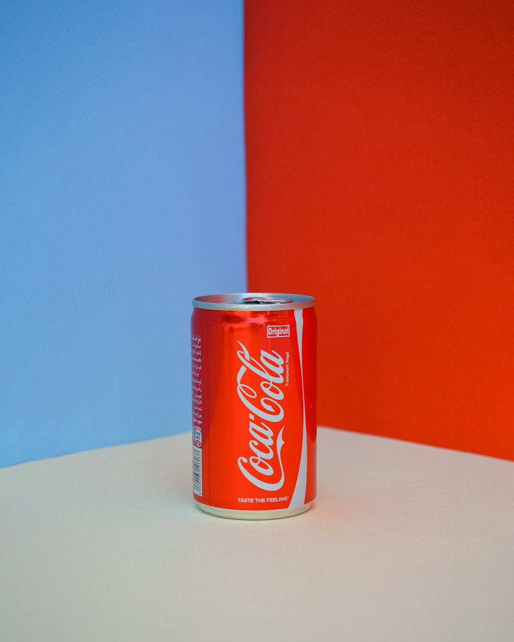 coca cola can on white table