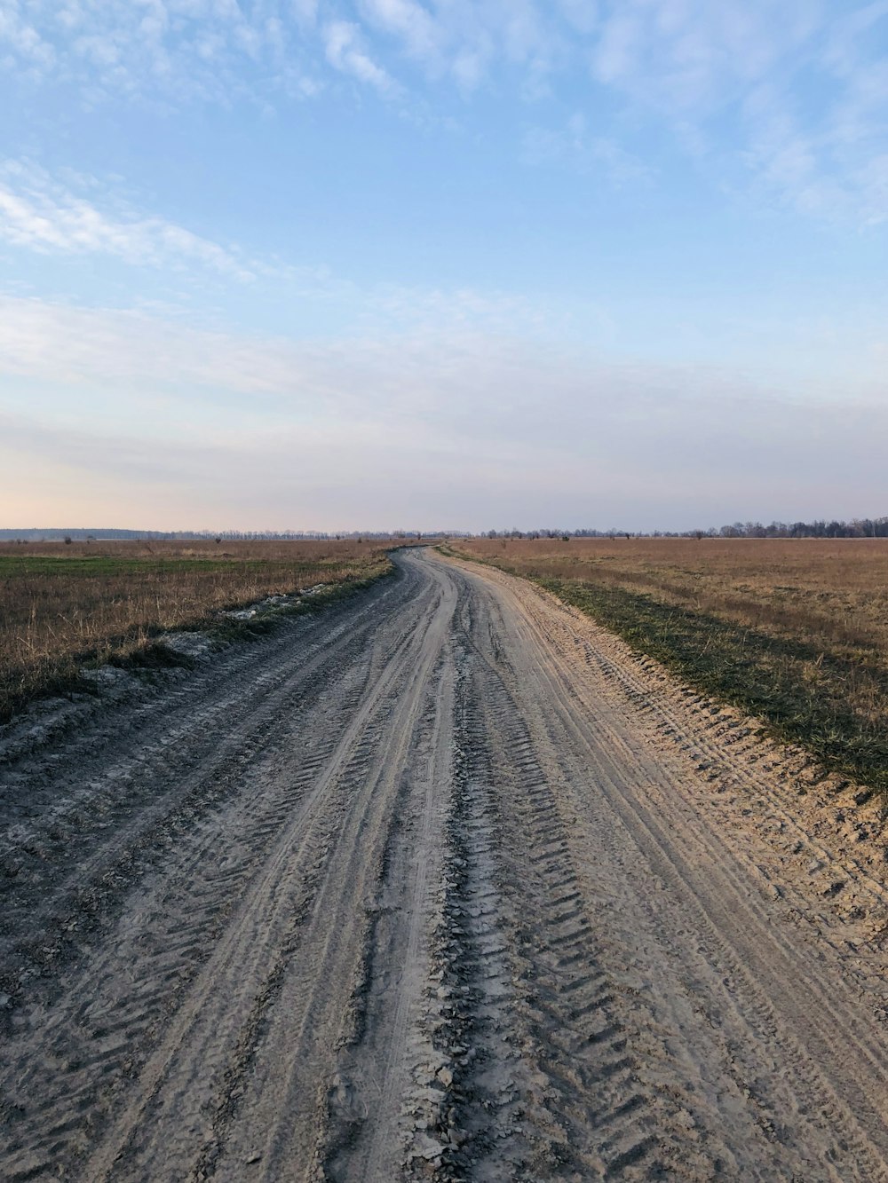 brown field under blue sky during daytime