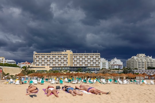 people on beach during daytime in Portimão Portugal