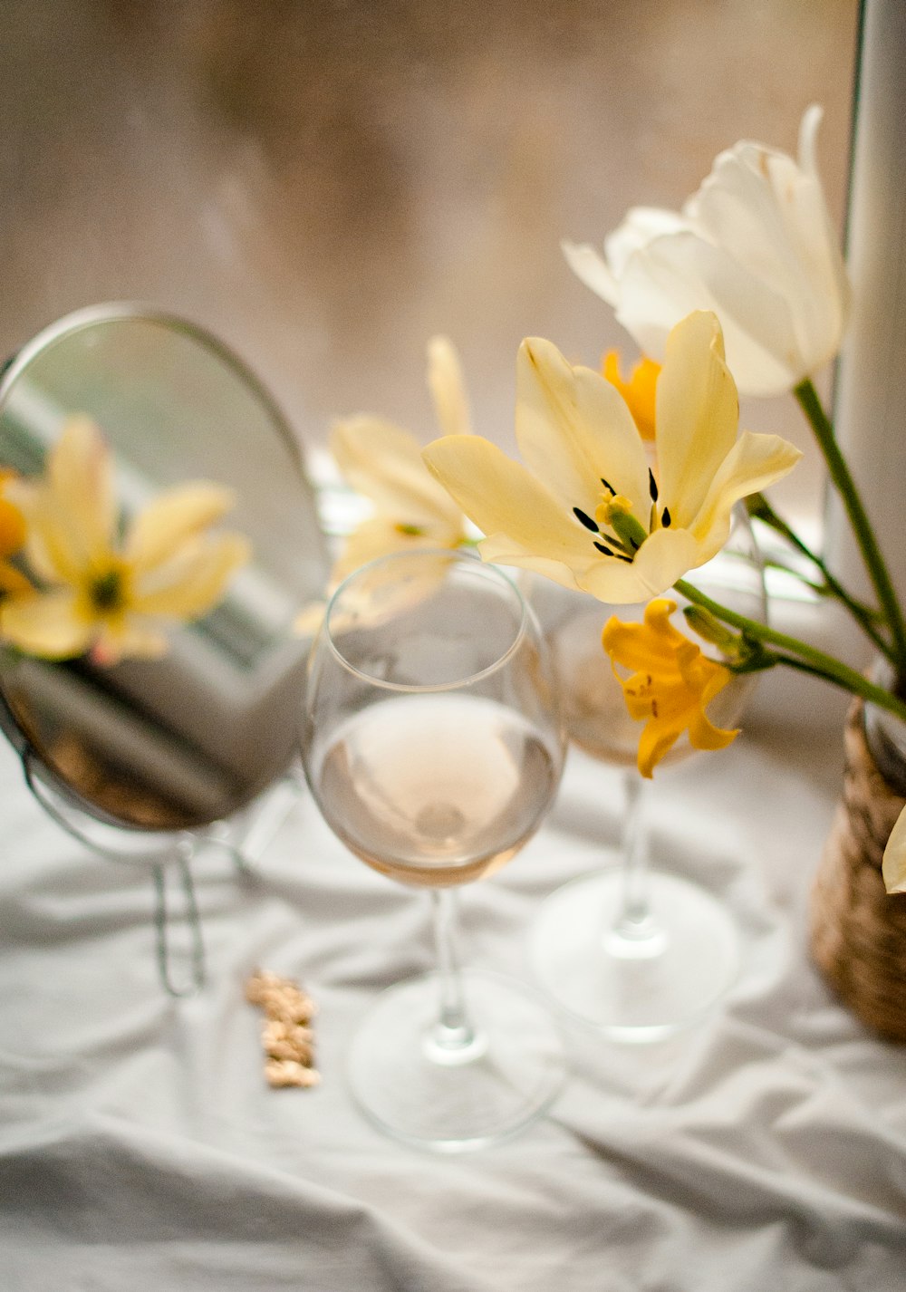 white roses in clear glass vase