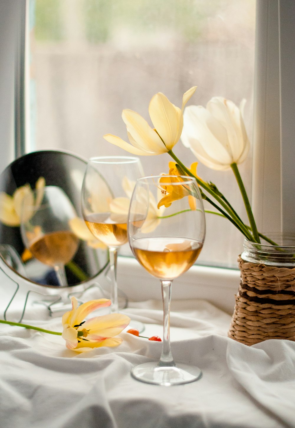 yellow tulips in clear glass vase