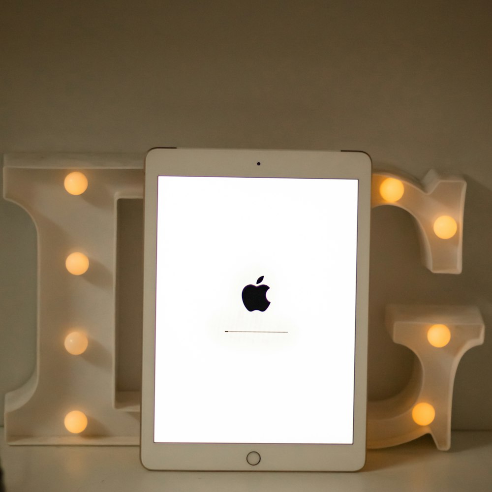 white ipad on white table