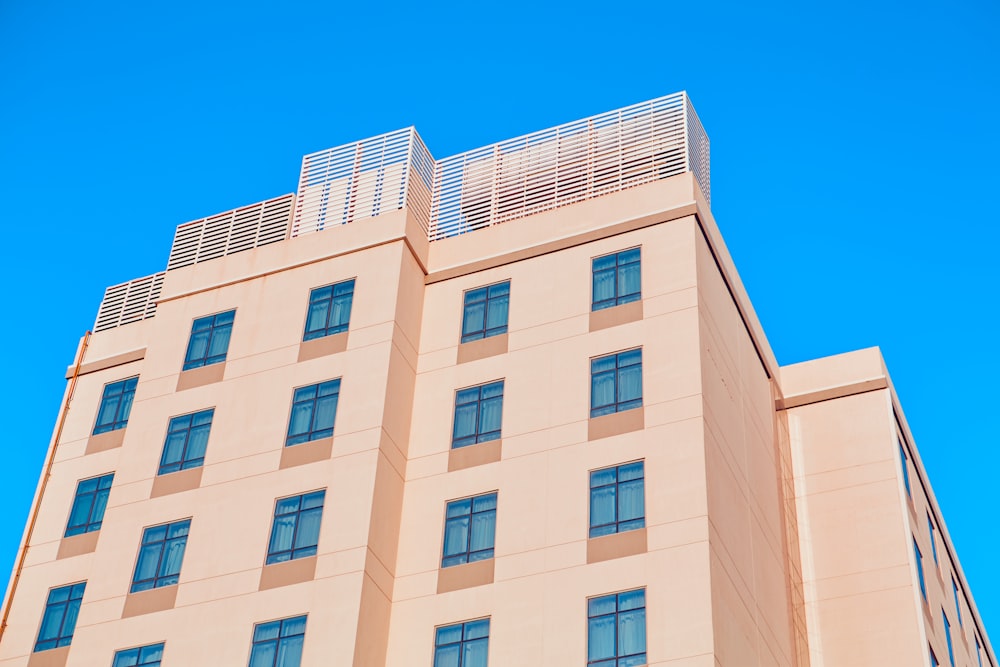 white concrete building under blue sky during daytime