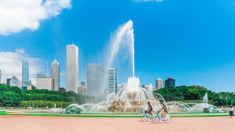 people riding bicycle on park during daytime