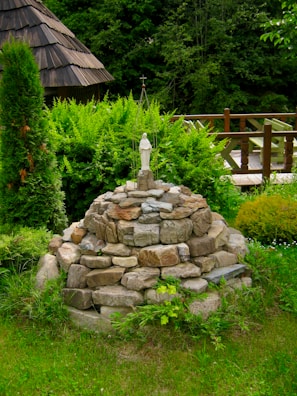 An ancient stone altar surrounded by lush greenery.