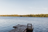 A quiet dock stretching into the still lake, perfect for fishing or reflection.