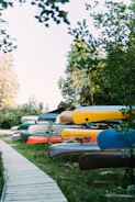 blue and orange kayak on gray concrete road during daytime