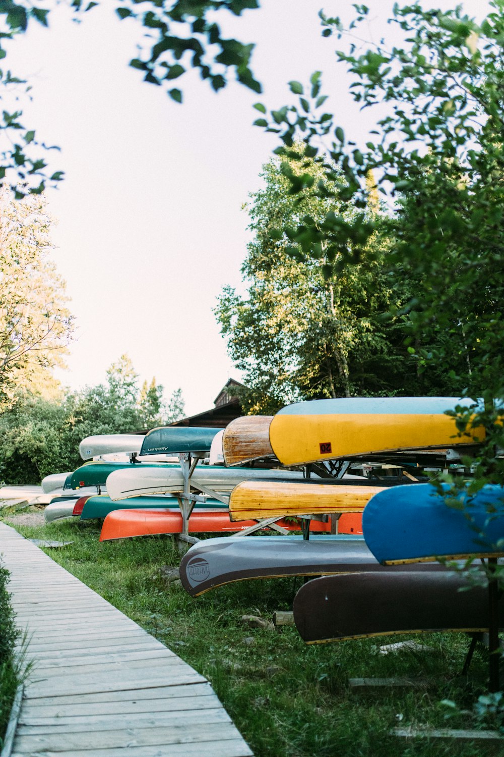 blue and orange kayak on gray concrete road during daytime