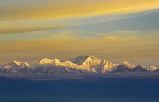 snow covered mountain under blue sky during daytime