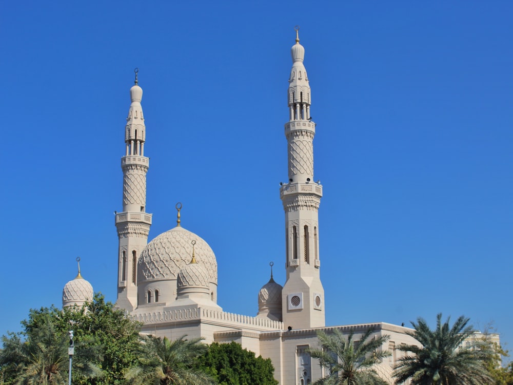 a large white building with two tall towers