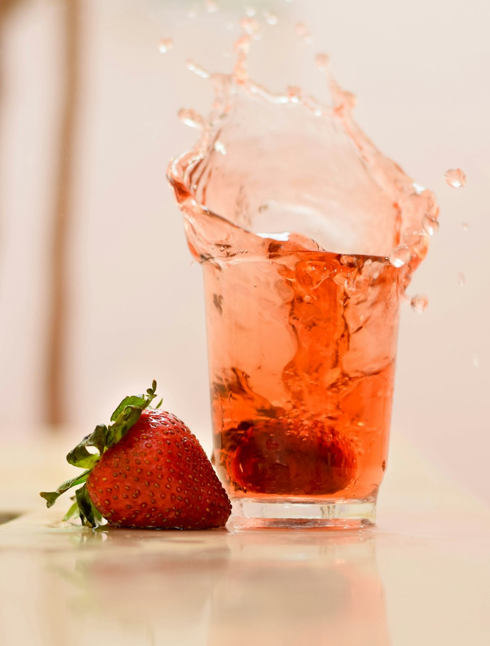 strawberry juice in clear drinking glass