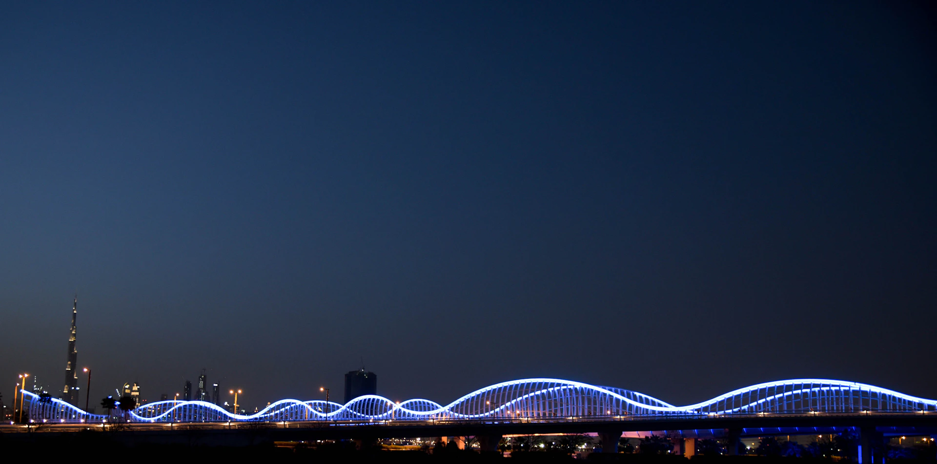 woman wearing yellow long-sleeved dress under white clouds and blue sky during daytime