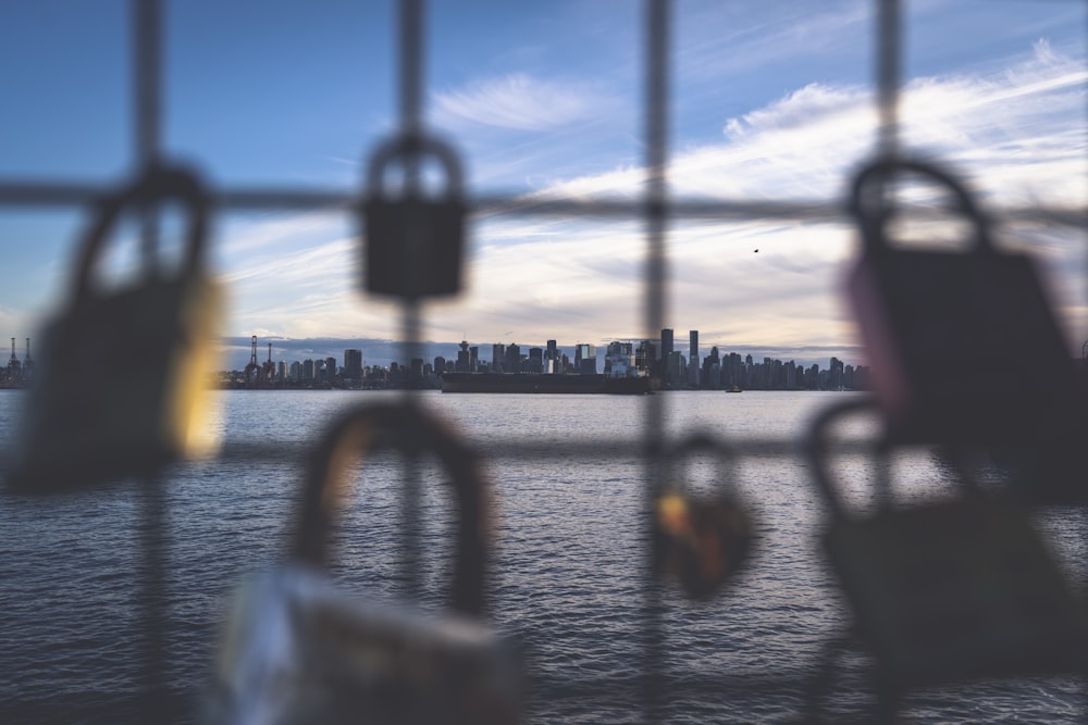 black padlock on brown wooden fence during daytime