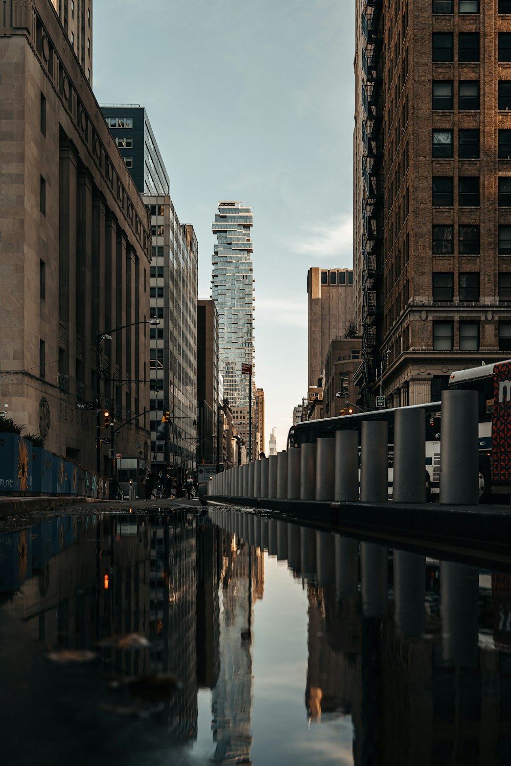 body of water between high rise buildings during daytime