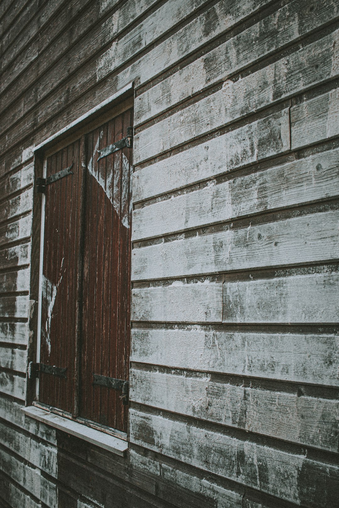 brown wooden door with white wooden frame