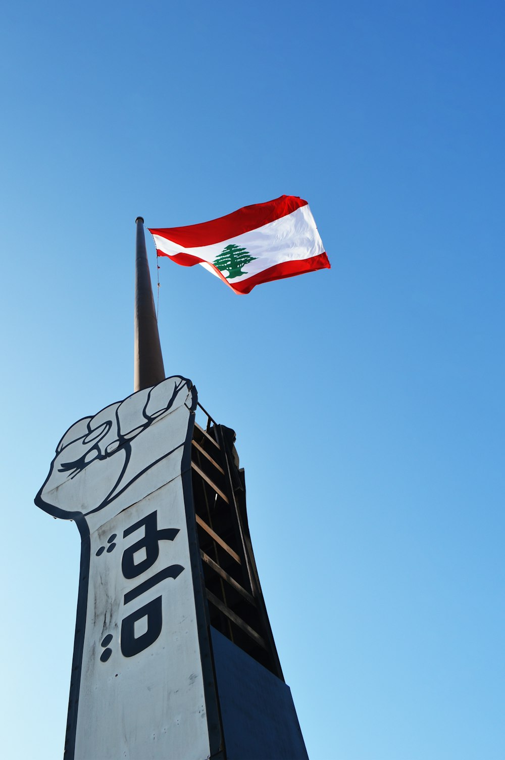 us a flag on top of black and white signage