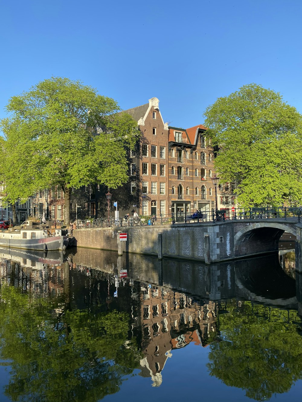 brown concrete building beside river during daytime