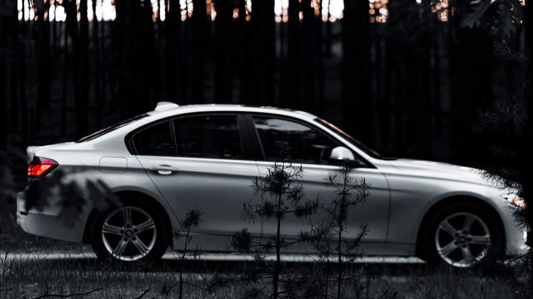 silver sedan on road during daytime