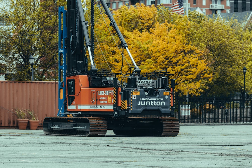 a construction vehicle is parked in a parking lot