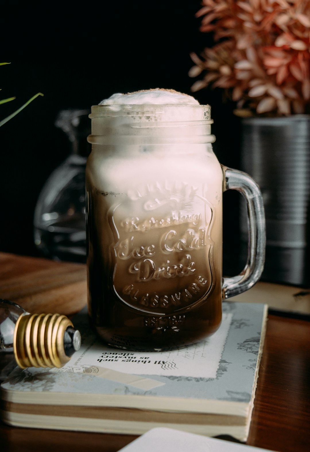 clear glass mug with brown liquid inside